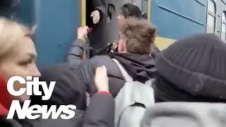 Large crowds gather at Ukraine train station to flee the country