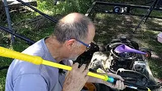 Changing lawn mower oil