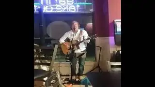 Dennis McCaughey performing his song Coconut Joe's