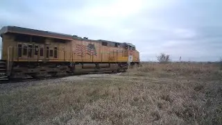 Northbound UP train with Canada grain hoppers on the Spine Line