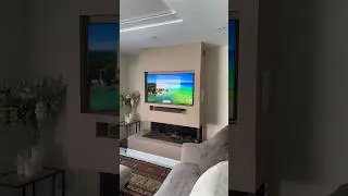TV and soundbar installation above fireplace. #samsung #soundbar #tv #audiovisual #setup