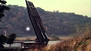 Mobile assault bridge vehicles move into position to form bridge over Main River ...HD Stock Footage
