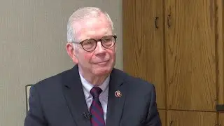 Protestors demand action from U.S. Congressman Tim Walberg over education funding concerns.