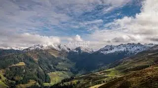 48964 Green valley with snowy mountains in background timelapse by Renclif Media Artgrid HD H264 HD