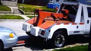 Tow truck fail No wheel straps no safty chains  driver