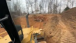 Dozing like a mad man trying to get this pit filled in before the rain!!