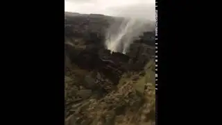 In the UK, winds of Storm Desmond causing a waterfall to flow up.