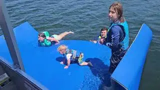 Troy, Vera, and Leif on the floating water mat