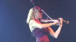 Sarah Mallock, electric LED violinist, performing for the Masquerade Ball, London