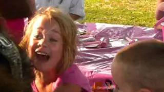 Makayla opening her Nintendo DS B-day present