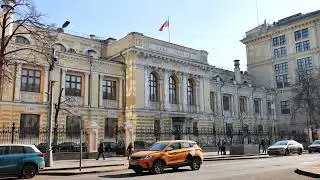 Moscow, Russia - Febrary 25, 2025: Bank of Russia building with russian flag waving in Moscow