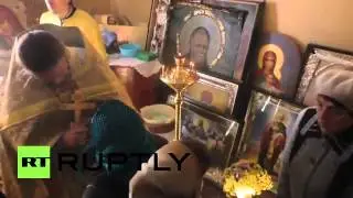 Ukraine  See Orthodox believers pray in shell battered church