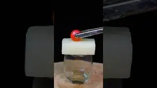 Experiment 1000 degrees glowing metal ball melting through candle wax 🕯️ #science #asmr