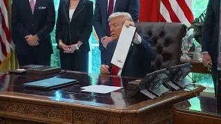 President Trump was busy putting his unique stamp on the government Friday