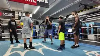 Coach Cisco working in the ring with Boxing Team Members on the step to the side technique.