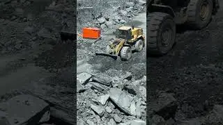 Loader making a ramp quarry
