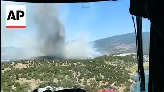 Firefighter helicopters and planes deployed to contain wildfires in western Turkey