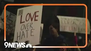 Demonstrators march in Denver in protest of ICE