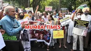 Depositors of PMC display placards during protest over Reserve Bank of India RBI's curb on the bank.