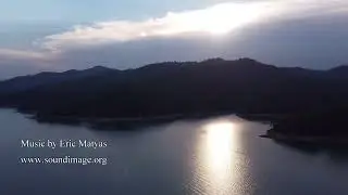 It is about to thunderstorm at sunset, McCloud River Arm, Shasta Lake, 08-2023 CA - 4k drone video