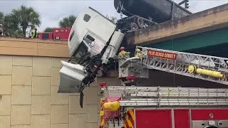 Driver Gets Emotional as He&rsquo;s Rescued From Dangling 18-Wheeler