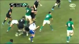 Cian Healy runs over Richie McCaw