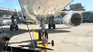 POV Pushback tractor pushing plane into position at Terminal 3
