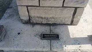 Stone rock Chimney swift tower for birds with plaque.
