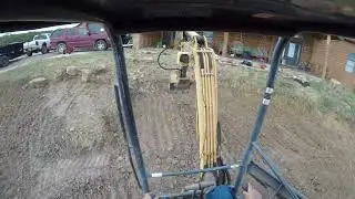Leveling yard with excavator