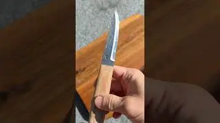 Modern puukko with handforged blade and natural canvas micarta handle. It&rsquo;s for sale.