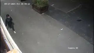 Vandal pouring paint along the front of our shop.