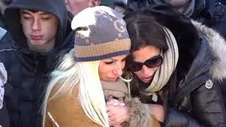 Swiss bar fire victims mourned as ID process continues | REUTERS