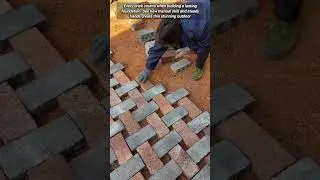 Professional Handyman Laying A Beautiful Herringbone Brick Path