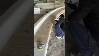 Landscape seating in curved concrete with preserved wood, production to initial installation
