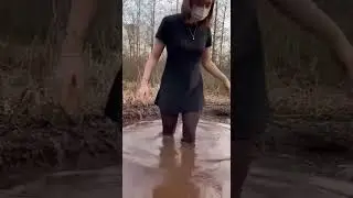 Girl in black tights gets into the mud