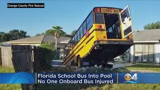 Driver, Students Okay After Bus Plunges Into Pool