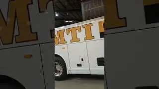 Rolling out a freshly painted bus back to the customer. | Peak Performance Collision Solutions