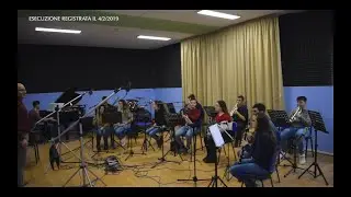 ♫ L'ensemble fiati esegue l'overture dell'opera 