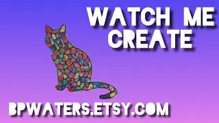 Designing alcohol ink wall art piece, cat sitting