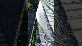 Cleaning gutters with All Seasons Gutter Guards Installed