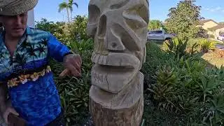 Tiki carver making a skull and marquesan tiki with chisels and power carving
