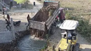 Filling the pit to prepare for new construction