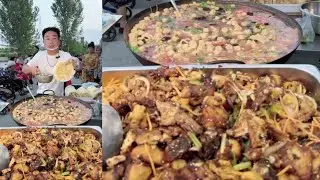 A Kind Chinese Guy Cook Free Meals / Noodles Food with Fish for the elders on the Street