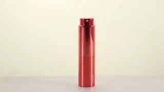 Gradual color anodized top spinning perfume atomizer