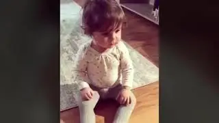 Little girl get frustrated with straw and cup