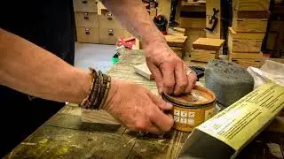Waxing a wooden three corner grain matched box