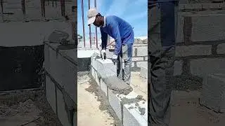 Laying mortar on concrete blocks to make a neat and sturdy concrete wall #construction #popular