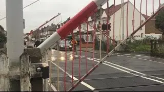 Trains Pass New Malden Level Crossing, London