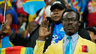 Afcon fan poses as statue for entire 115-minute match in amazing tribute while supporters dance behi