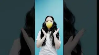 A Woman demonstrate how to wear protective mask